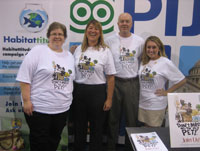 PIJAC’s staff, including President Pamela Stegeman (second from left) models “Don’t Mess with My Pet” t-shirts